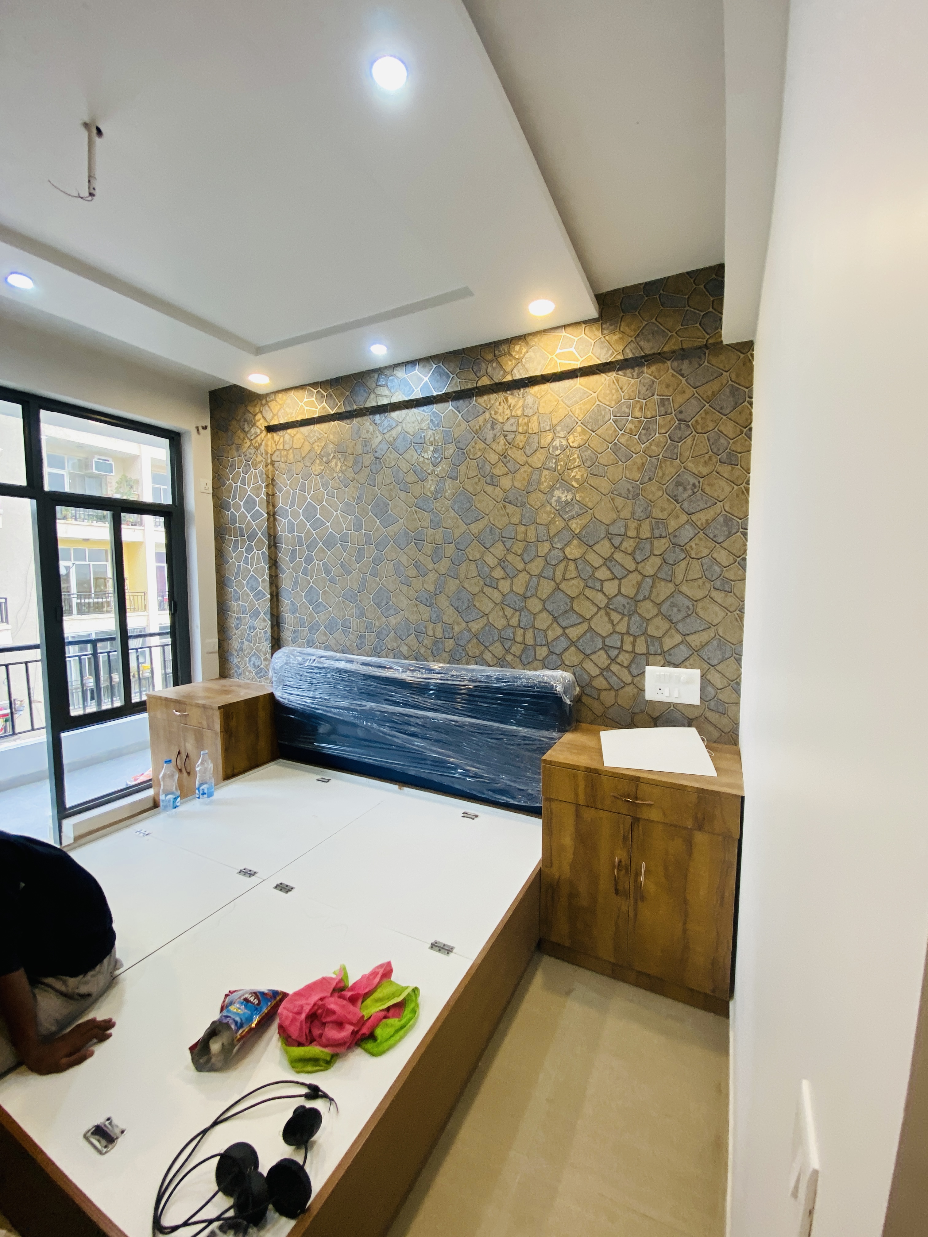 Bedroom stone feature wall and side storage